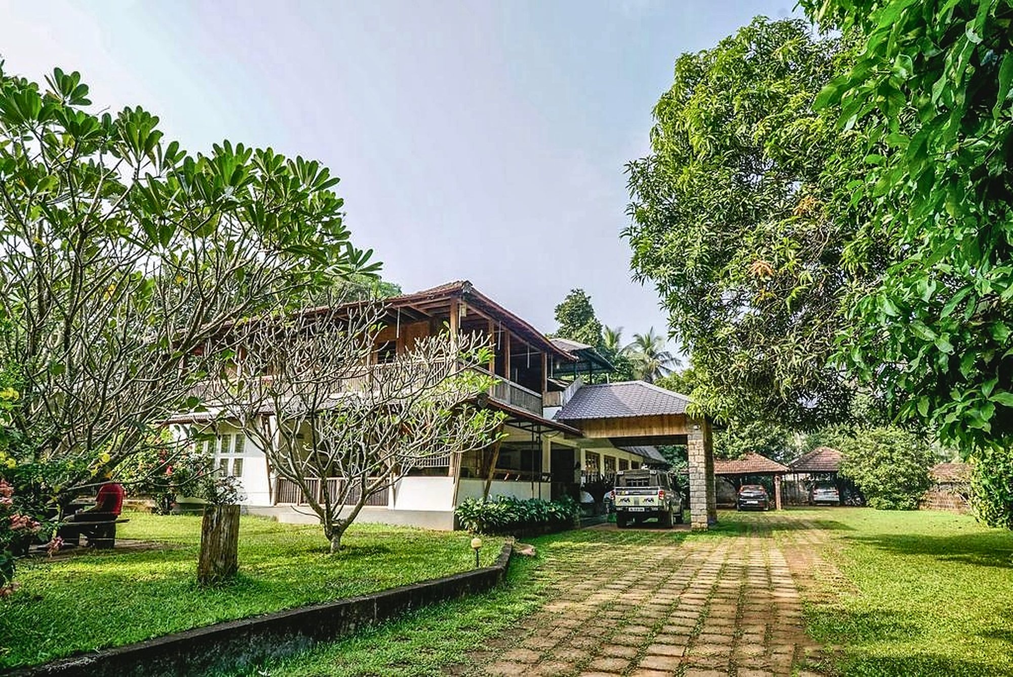 The Teak Town house seen from the frangipani garden path